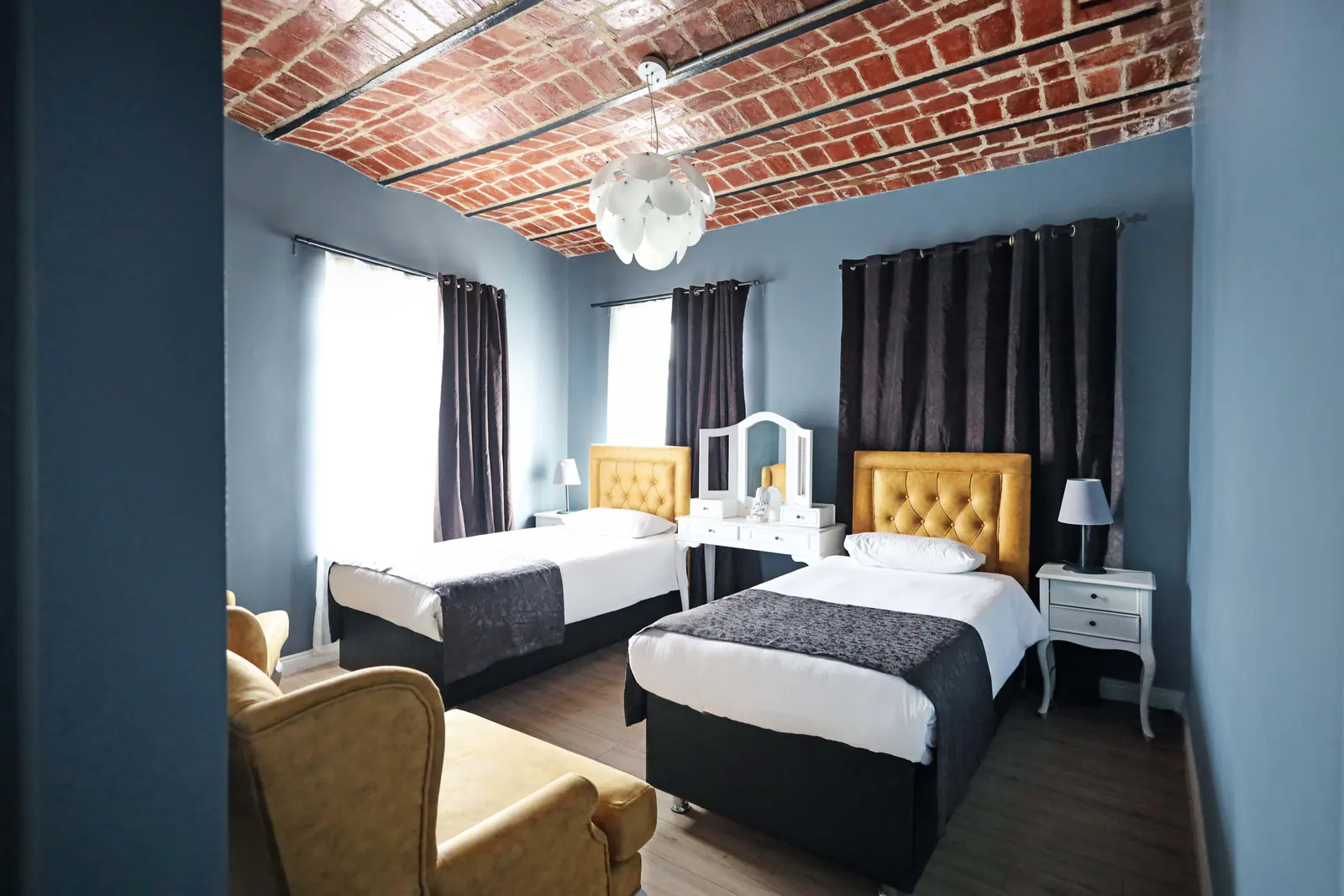 Family Suite with Balcony — sleeping area