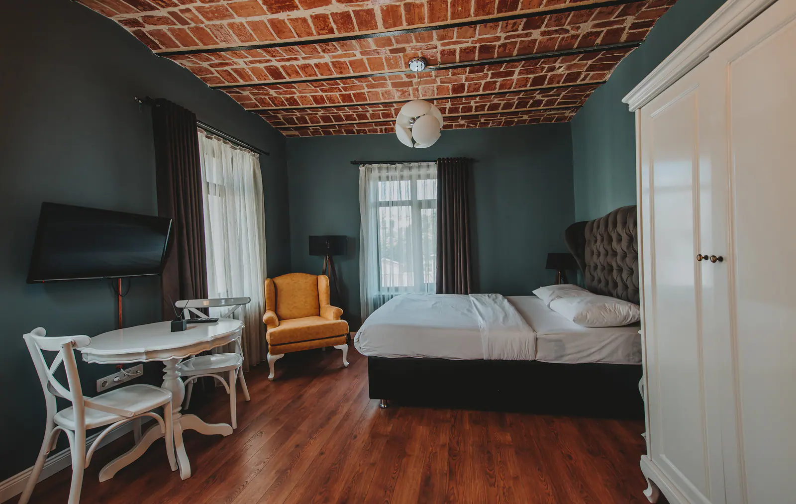 King Studio with Balcony — wide view of the suite
