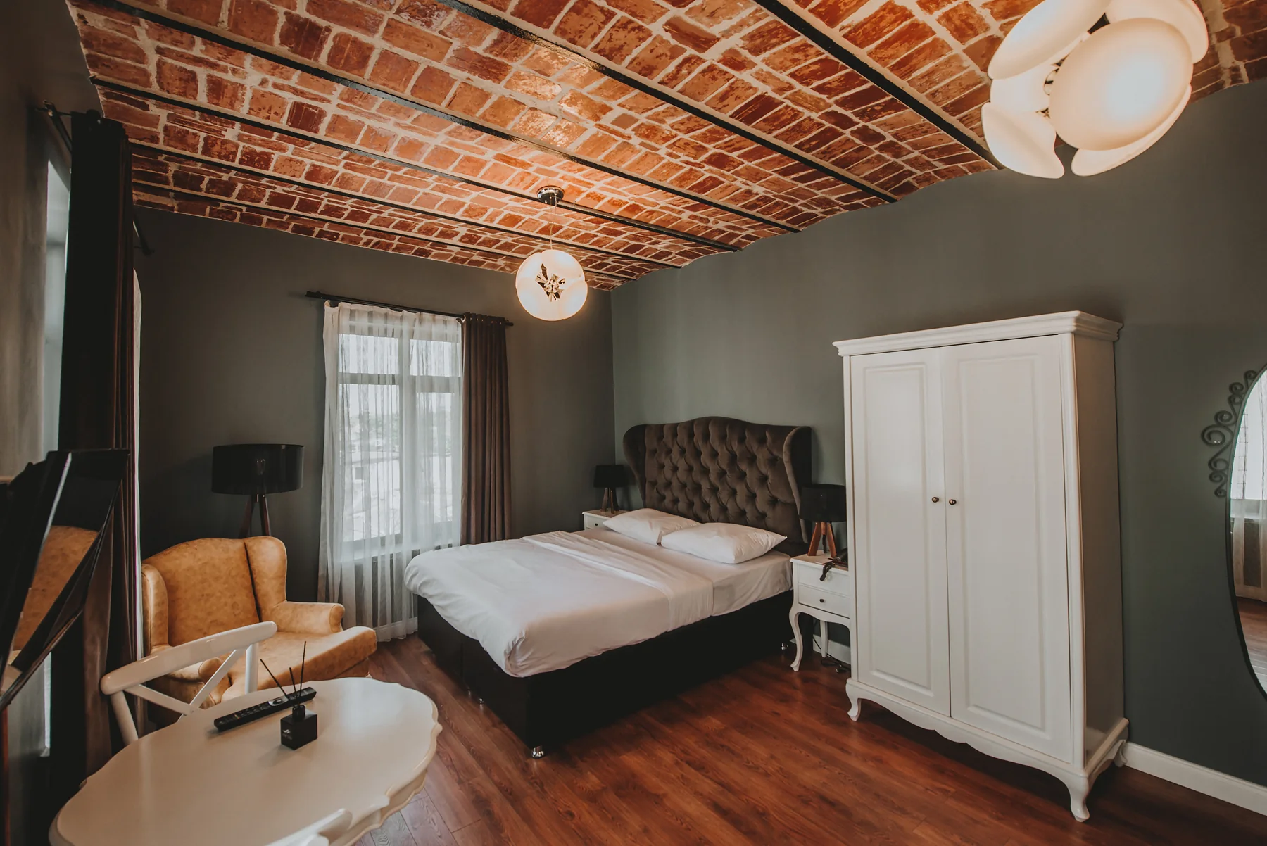 King Studio with brick ceiling