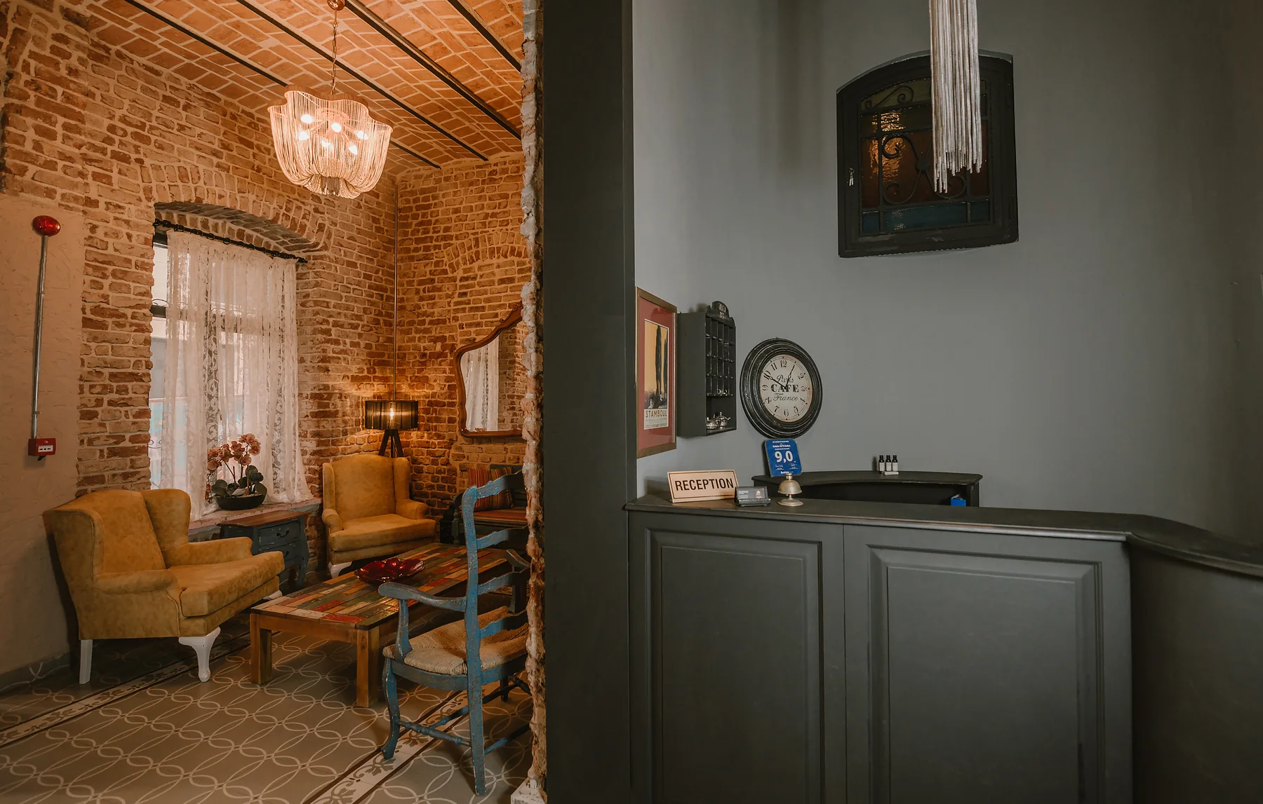 Selvese Suites reception lounge with exposed brick ceiling